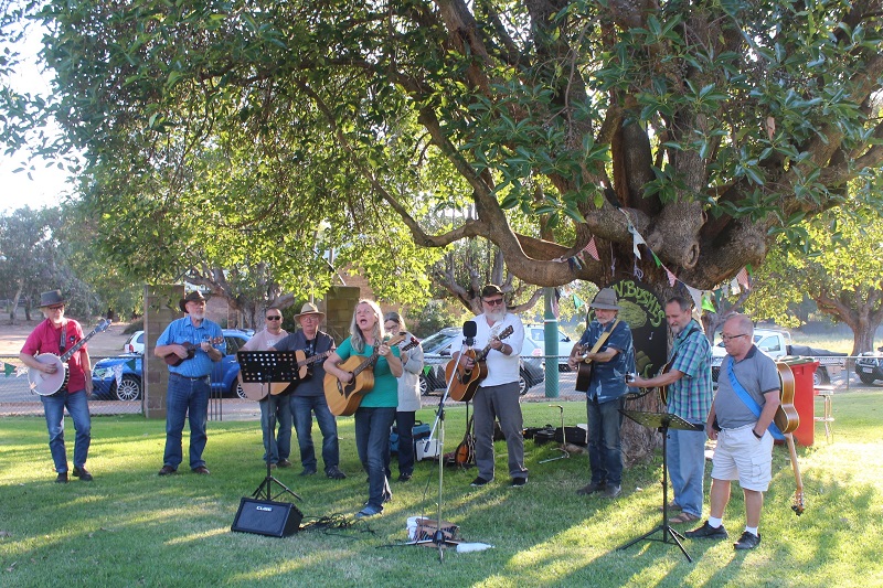 Musicians meeting under a tree